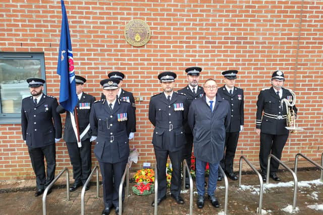 Police officers pay their respects to the memorial plaque for war hero Detective Inspector James O’Donnell who was shot just 100 yards from the old Blackburn Police Station in Northgate on December 13, 1958