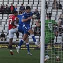 Caleb Watts heads in Morecambe's second goal against Everton's U21s Picture: Michael Williamson