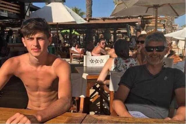 Luke on holiday with his dad, former professional footballer Tom Bennett (Image: Facebook).