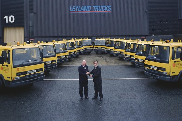 Mr Tony Hindle, general manager of Lancashire County Engineering Services, being presented by Keith Howard, engineering director of Leyland Trucks, with the keys for one of the fleet of twelve Leyland built 45 series, supplied by Lancashire Leyland DAF in 1997