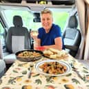 Karen enjoying some food and wine in her motorhome