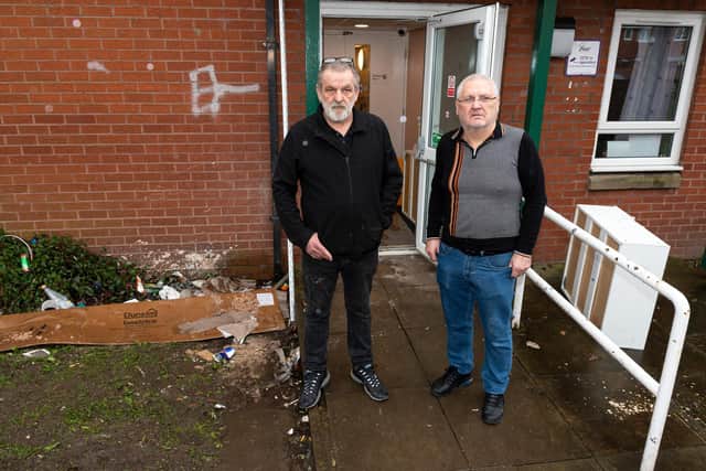 Gary Burgess and John Fraser outside a fire door which is constantly being broken and left open at New Brook House in Preston. They claim this is letting unwanted visitors roam the corridors late at night, meaning residents feel unsafe in their homes and that no-one is doing anything about it