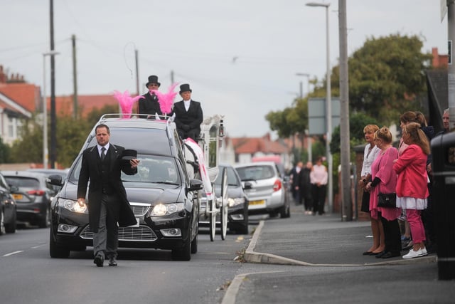 The funeral procession makes its way to the church