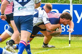 Corey Bowker drives over to score Lancashire's second try against Yorkshire Photo: Andy Sowden