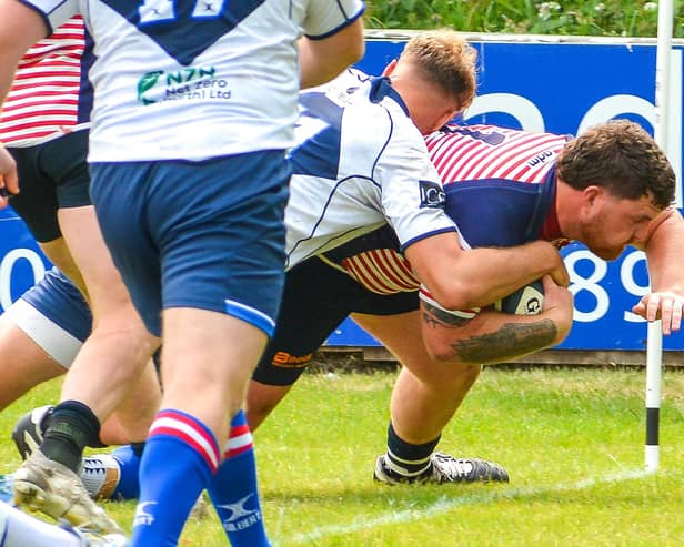 Corey Bowker drives over to score Lancashire's second try against Yorkshire Photo: Andy Sowden