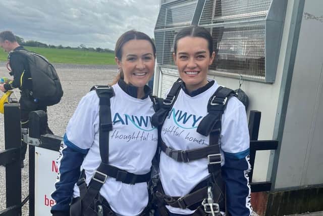 Homes advisors Sam France and Steph Tam took part in a skydive in aid of Derian House. Photo Anwyl Homes
