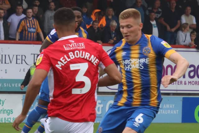 Morecambe defender Max Melbourne closes down Shrewsbury Town's Taylor Moore Picture: Ian Lyon