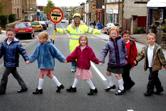 Lancashire's longest serving lollipop person Irene Reid outside Longridge CE School