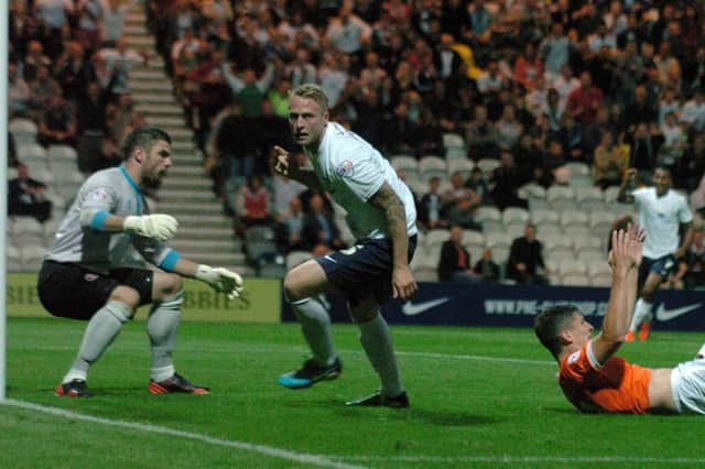 Who put the ball in the Blackpool net? Super Tommy Clarke did.......Tom Clarke turns to celebrate after scoring PNE's winner against Blackpool in August 2013.