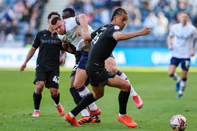 Milutin Osmajic battles for possession with Stoke City’s Ashley Phillips (photo: Alex Dodd/CameraSport)