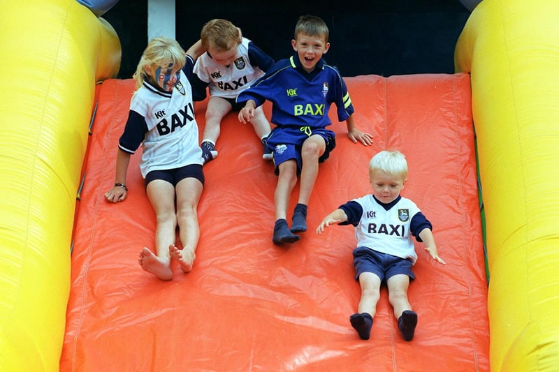 Follow that fan..... Preston youngsters (from left) Amy Wilson, Liam Cross, Jonathan Procter and James Procter on a slippery slope at the Preston North End Fun Day at Deepdale, Preston
