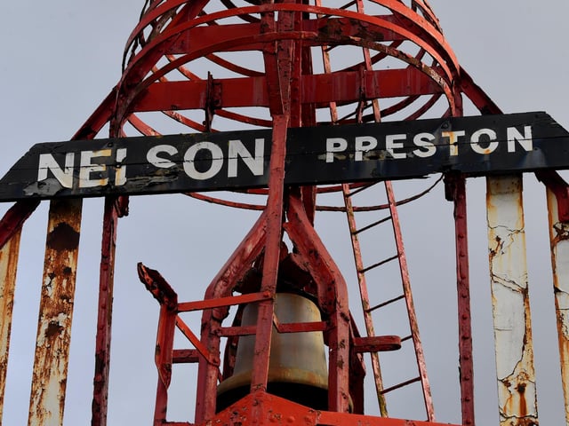 The Nelson red 'bell-boat' buoy at the entrance to Preston Docklands
