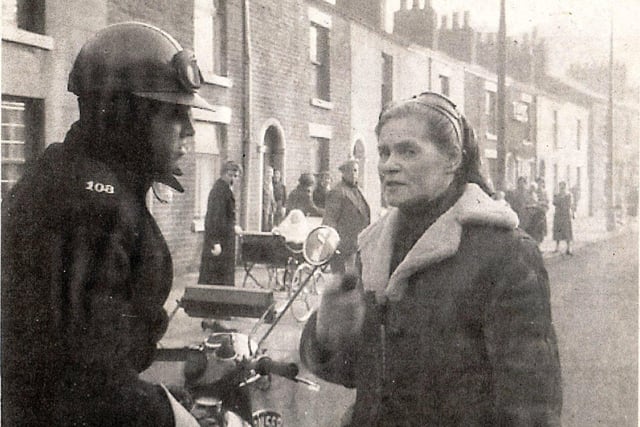 Dr. Barbara Moore, Preston 1960
Preston Police Constable A. M. Macphee on escort duty, is seen talking to Dr. Barbara More in Preston during her long distance walk from John O' Groats to Land's End.
British Pathe' filmed her arrival in Lands End. Watch Here
Photo: A. Willacy
Dr Barbara Moore (22 December 1903 – 14 May 1977) was a Russian-born health enthusiast who gained celebrity in the early 1960s for her long-distance walking.
In December 1959 she walked from Edinburgh to London. In early 1960 she walked from John O' Groats to Land's End in 23 days. She then undertook a 46 day, 3,387 mile walk from San Francisco to New York City, where she arrived on July 6, 1960.
She was a vegetarian and reputed to be a breatharian. She walked with only nuts, honey, raw fruit and vegetable juice for nourishment. She died in a London hospital on 14 May 1977.