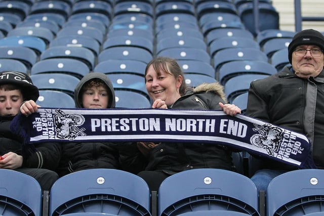 Preston North End fans show their scarf before the game