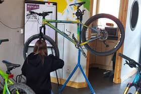 Work on bikes at the WAVE's bike hub