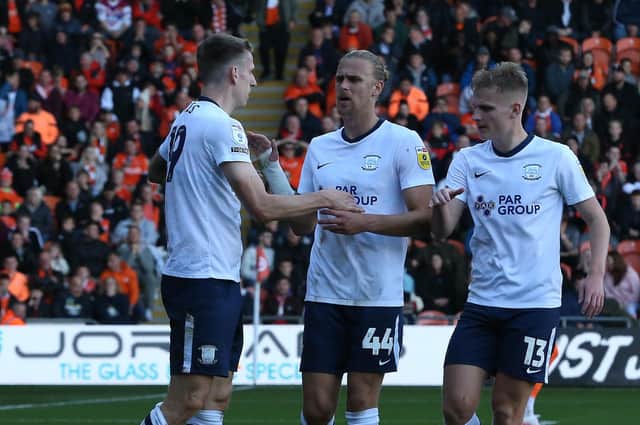 Preston North End's Emil Riis (left) is congratulated by team-mates Brad Potts  and Ali McCann (right) after he won a penalty for a challenge on him by Blackpool's Marvin Ekpiteta.