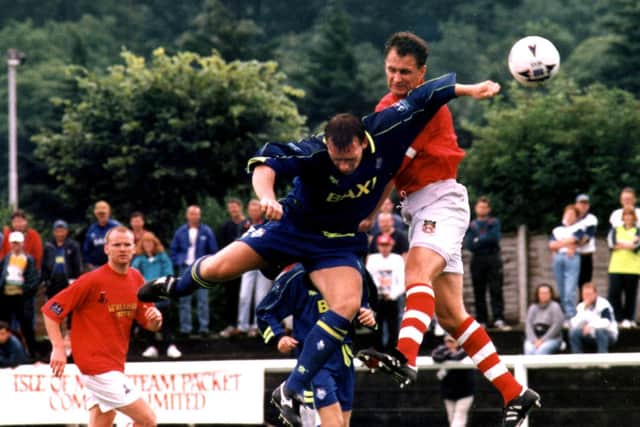 Simon Davey goes up for a header for Preston North End against Wrexham in the Isle of Man International Festival final