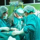 Surgery operation surgeons doctors nurses operating theatre