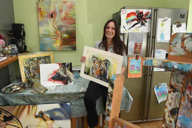 Artist Rebecca Findlay, 40, from Eaves Green in Chorley wants to thank whoever bought her tiger painting entitled Vulnerability in Strength' for £360