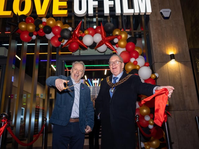 Nick Park cutting the ribbon at The Arc Cinema
