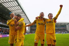 Preston North End players celebrate their third goal against Blackburn Rovers