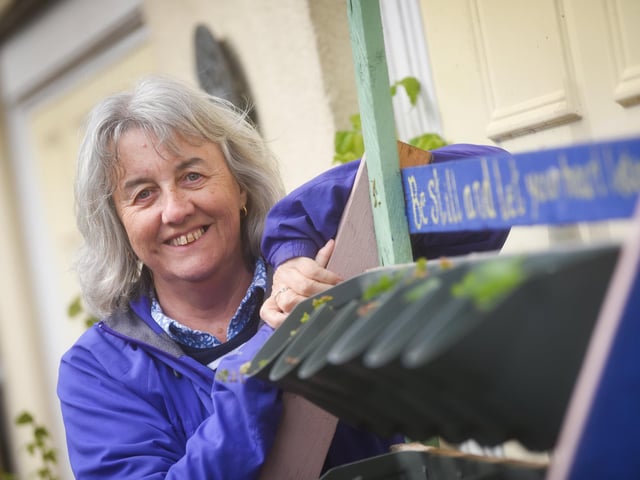 A group of residents have created a community garden in their alleyway called Strawberry Gardens. Pictured is Julie Brierley.