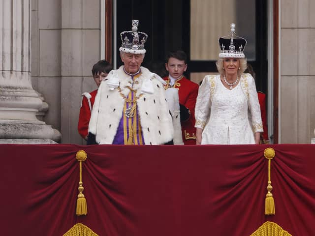 King Charles III and Queen Camilla on the Buckingham Palace balcony after the Coronation (Picture: Dan Kitwood/Getty Images)