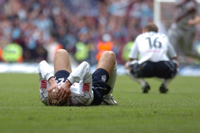 Richard Cresswell and Paul McKenna are dejected at the final whistle.