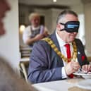 The Mayor of South Ribble taking part in the Dinner in the Dark at Centurion Village.  Photo: Barratt and David Wilson Homes