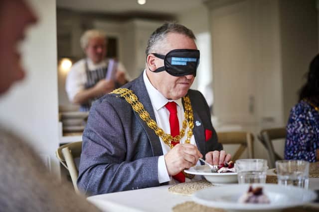 The Mayor of South Ribble taking part in the Dinner in the Dark at Centurion Village.  Photo: Barratt and David Wilson Homes
