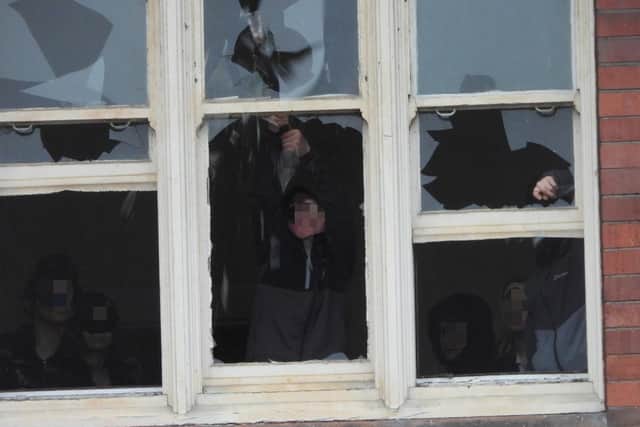 Youths photographed on the upper floors of the building in March 2023