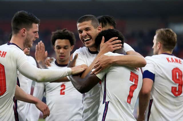 England players celebrate after scoring against Austria.