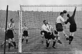 1st May 1937: Sunderland goal keeper, Mapson, attempts to clear his lines during the FA Cup final match between Sunderland FC and Preston North End at Wembley. Sunderland went on to win the trophy with a 3-1 victory.  (Photo by Topical Press Agency/Getty Images)