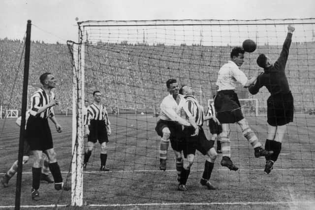 1st May 1937: Sunderland goal keeper, Mapson, attempts to clear his lines during the FA Cup final match between Sunderland FC and Preston North End at Wembley. Sunderland went on to win the trophy with a 3-1 victory.  (Photo by Topical Press Agency/Getty Images)