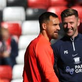 Preston North End coach Paul Gallagher (right) says hello to Sunderland's Bailey Wright (left) at their game earlier this season