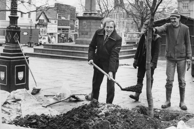 Coun Harold Parker plants a tree to put the finishing touches to the revamping of the Flag Market in 1985