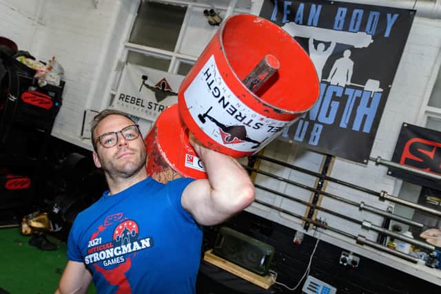 Josh Lancaster will be attempting a world record of lifting around 15 and a half stone with one hand at the weekend in Preston