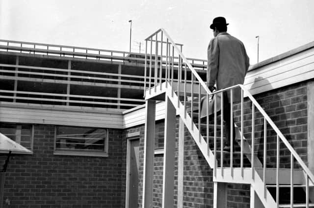 The mystery man makes his way up a staircase to the roof of St George's Shopping Centre in Preston