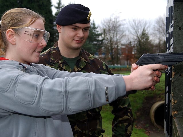 Collette Carthy of Ribbleton Hall High School tries her hand at pistol shooting at Fulwood Barracks during the Army Games event in 2003