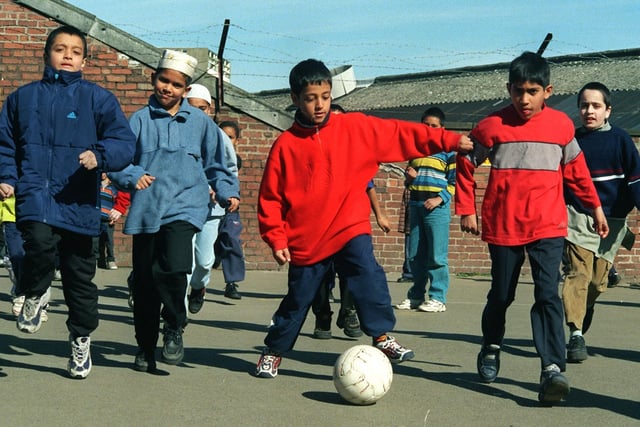 The children of Frenchwood Community School enjoy a game of football in the playground