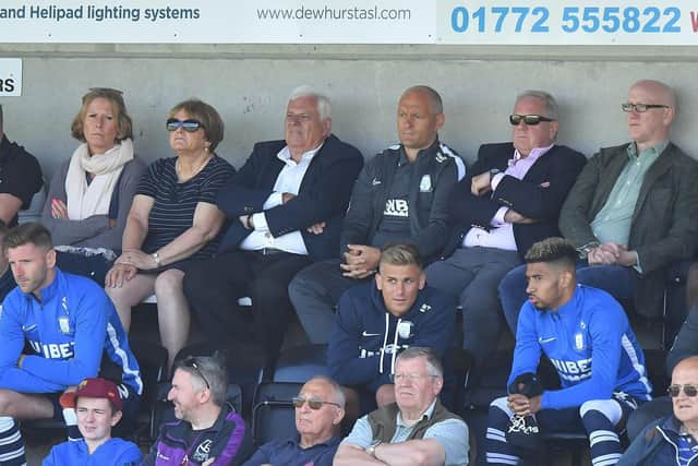 PNE manager Alex Neil sits alongside director Peter Ridsdale, other PNE staff and players during the game
