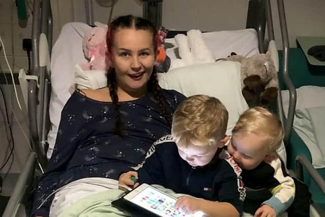 Casey Singleton, 22, who suffered an unexplained stroke on Nov 20 2022, pictured with her sons Tommy, 1, George, 3.