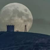 The moon rising over Rivington Pike in Chorley.