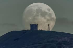 The moon rising over Rivington Pike in Chorley.