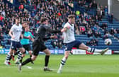 Preston North End's Liam Lindsay controls under pressure from Reading's Tom Holmes