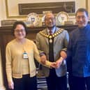 Tina Yuen and Raymond Chung, recently reunited in Preston, met up with city mayor Yakub Patel (centre)