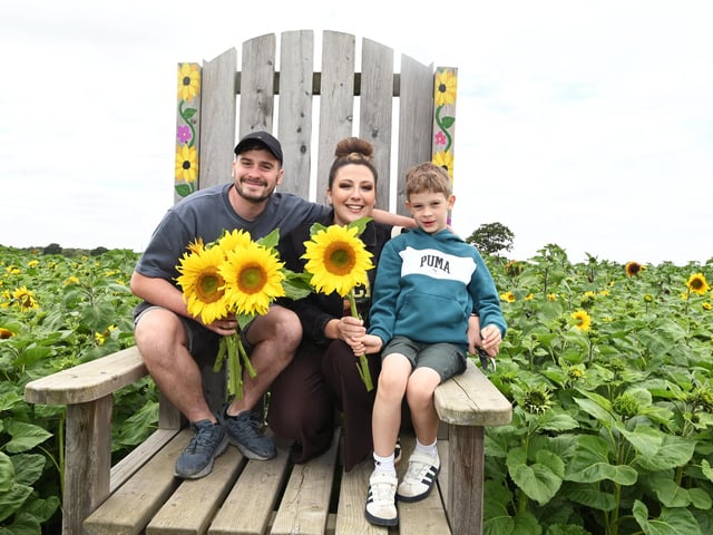 Dominic and Hannah Shelley with Ezra, eight, having fun at Bretherton Sunflowers fields.