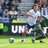 Preston North End's Jordan Storey battles for the ball