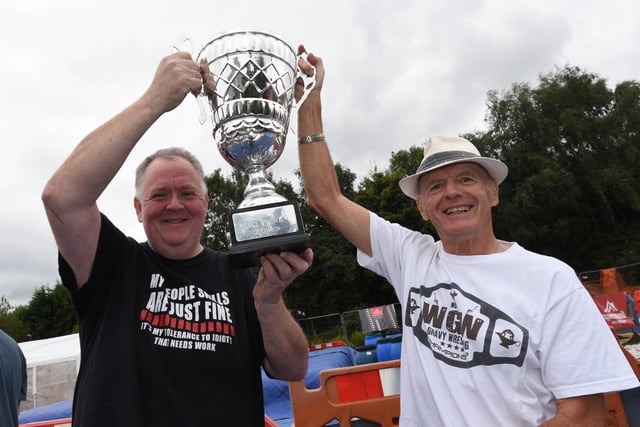 Landlord Jon Lowe and part of the organising team Ken Claxon, right, with the trophy