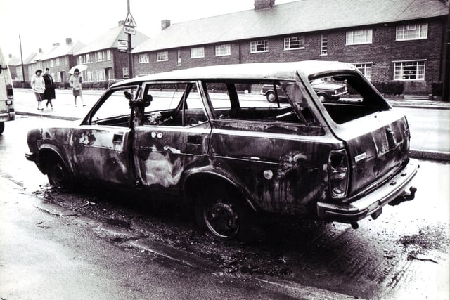 Burned out estate car  in Parson Cross April 7, 1974
